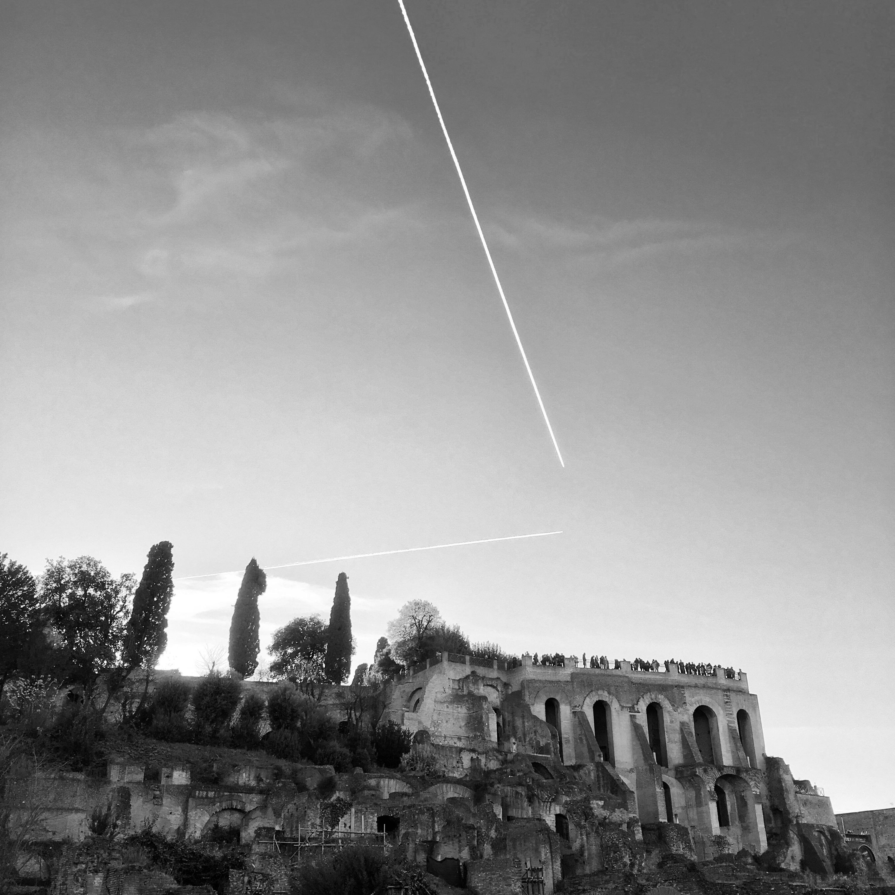 Palatine Hill from Roman Forum with contrails – Black and White