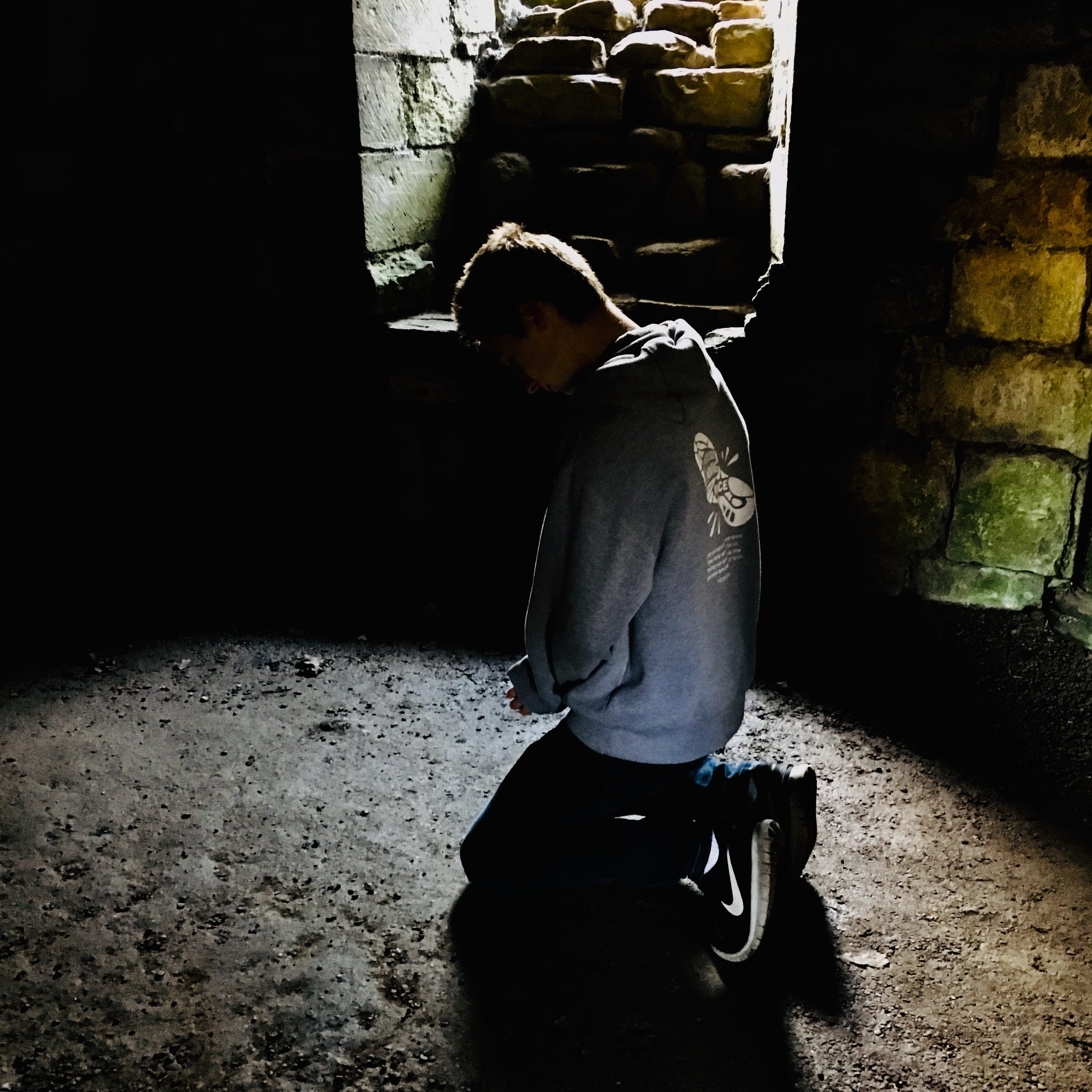 Youth praying, Finchale Priory