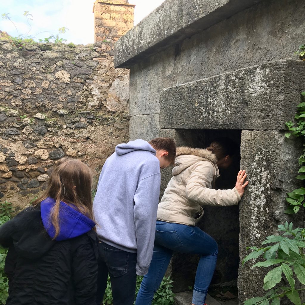Entering a tomb in Pompeii