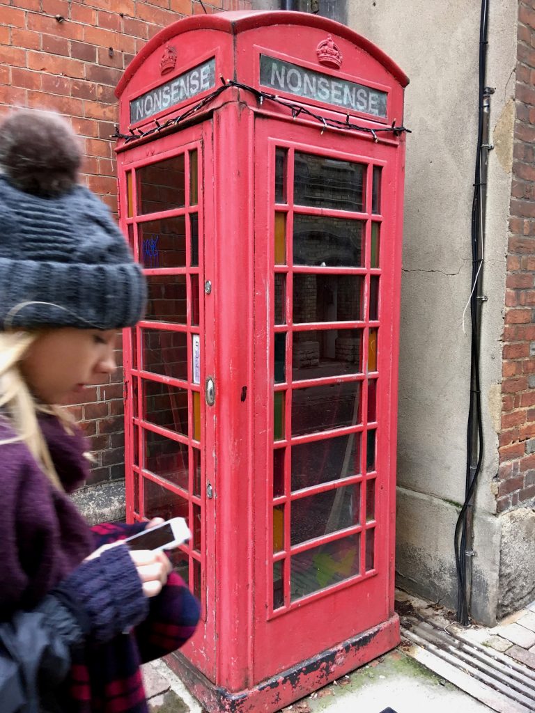 Walking past a telephone booth in Oxford
