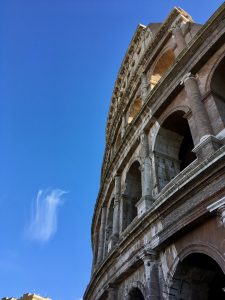 Colosseum with cross-shaped clouds