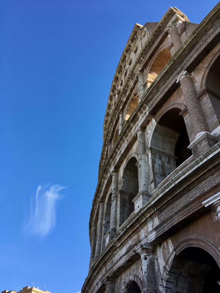 Colosseum with cross-shaped clouds