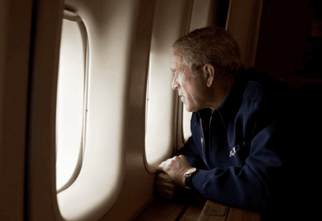 President George W. Bush looks out over the devastation in New Orleans from Hurricane Katrina.