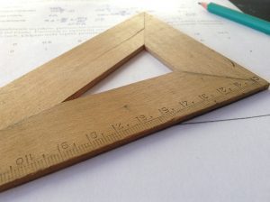 Wooden set square. Photo by Dawid Malecki on Unsplash