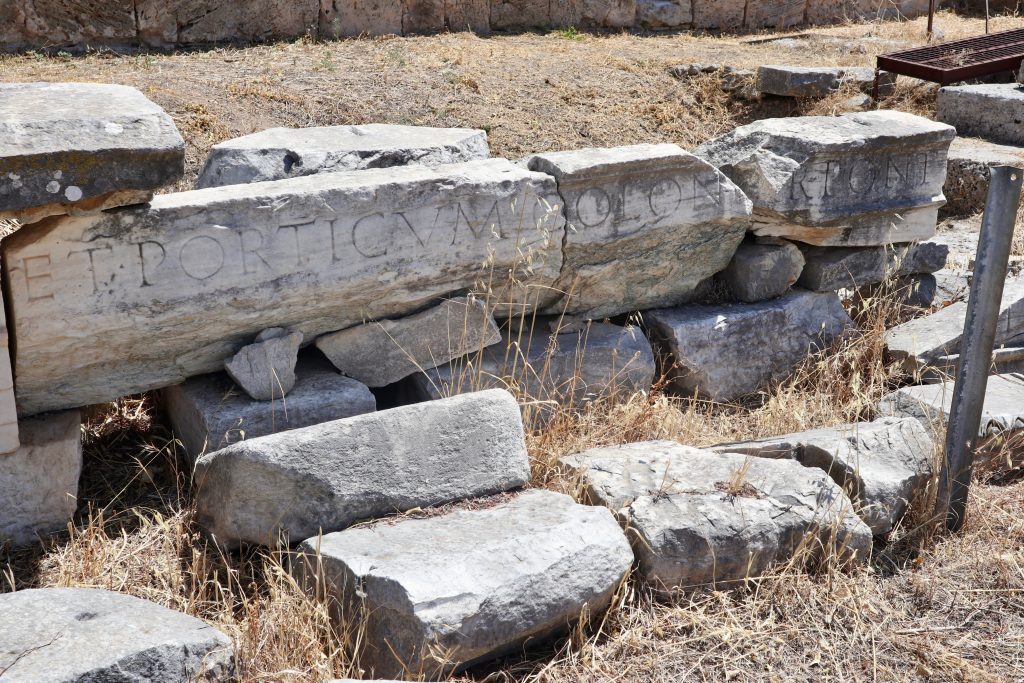 Ancient Corinth, Roman marketplace, East end. An inscription, probably describing who built or restored the building