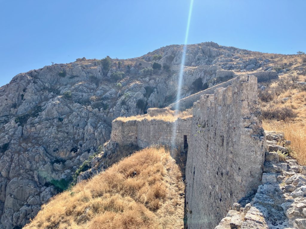 Acrocorinth, Northern wall. Looking up to Temple of Aphrodite (peak)