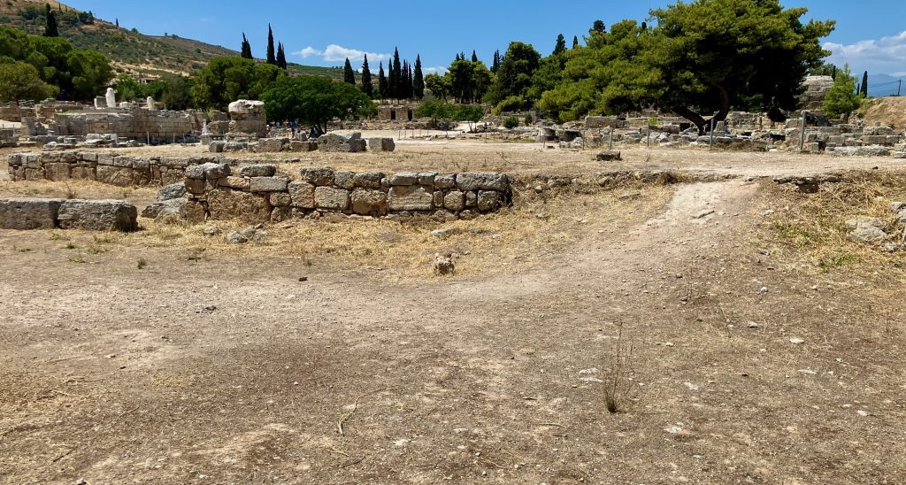 Ancient Corinth Roman marketplace - East end. Start of racecourse.
