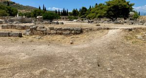 Ancient Corinth Roman marketplace - East end. Start of racecourse.